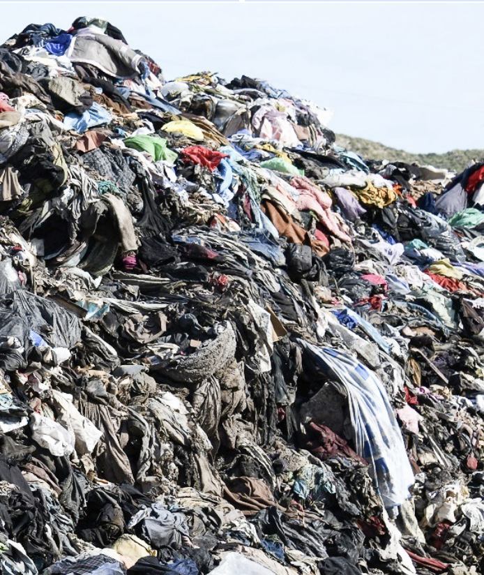 PILES OF CLOTHES ROT in a landfill